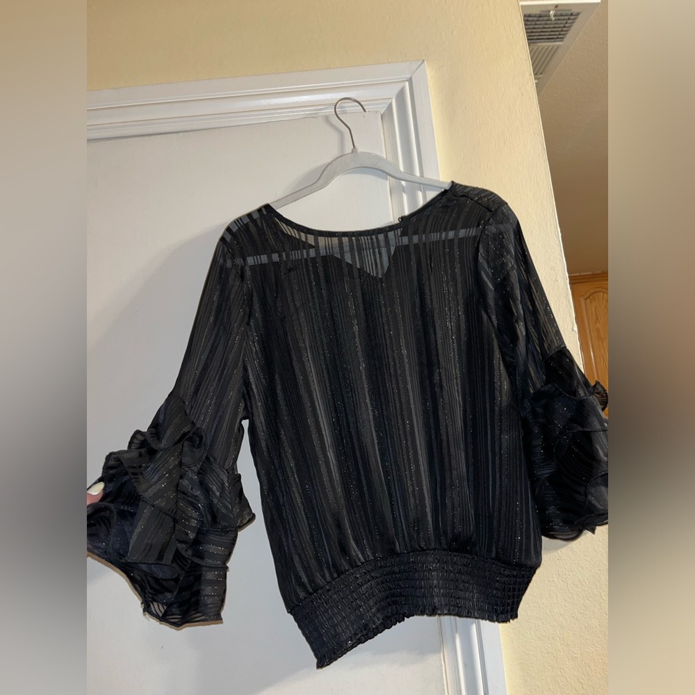 Black top with ruffle sleeves